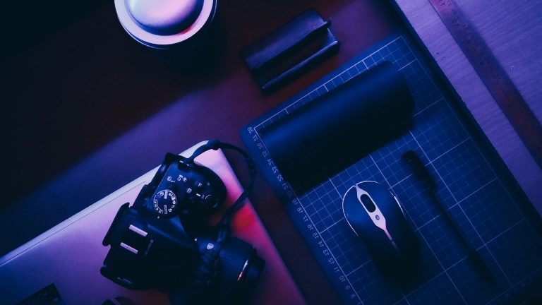 DSLR camera and mouse on cutting mat